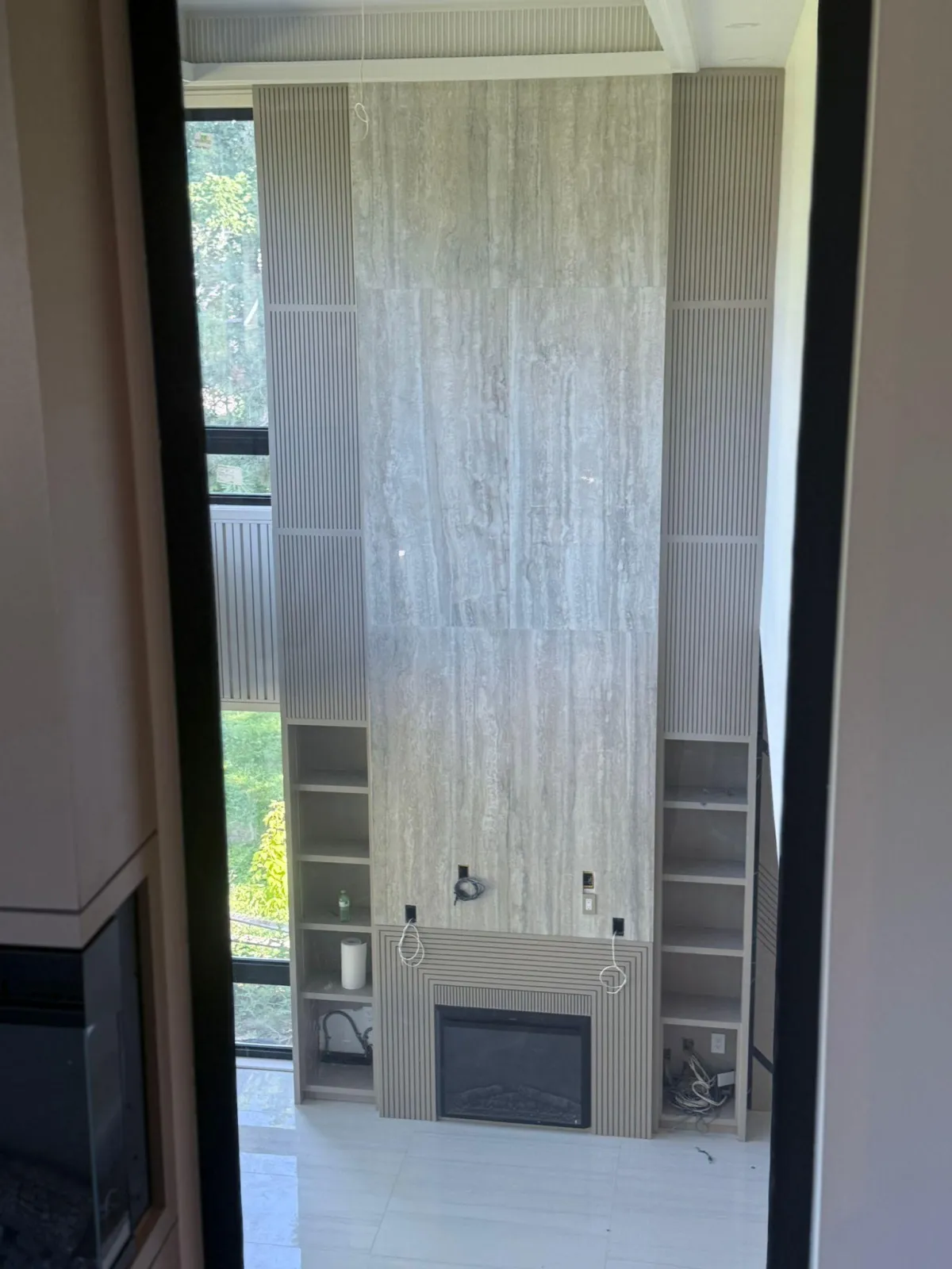 Custom fireplace tiling installation in Whitby by GH Tiling