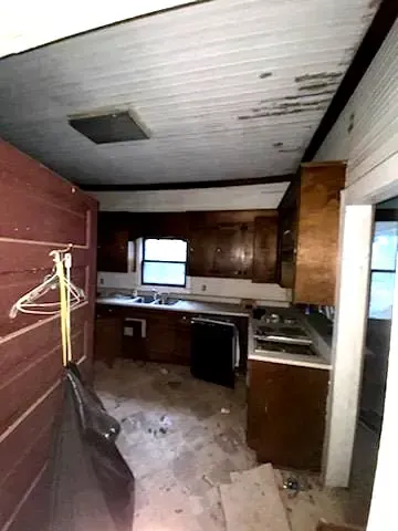 What we walked into: kitchen of a single-family home in Greenwood, South Carolina, before restoration by Eby and Co.