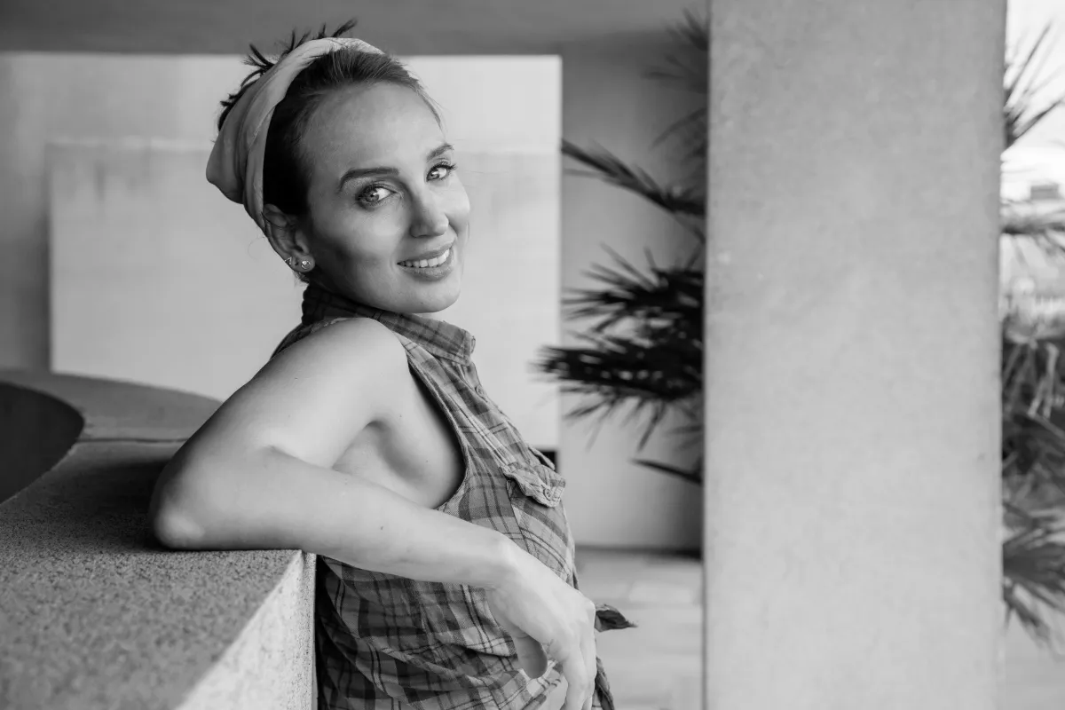 woman in black and white picture smiling at camera