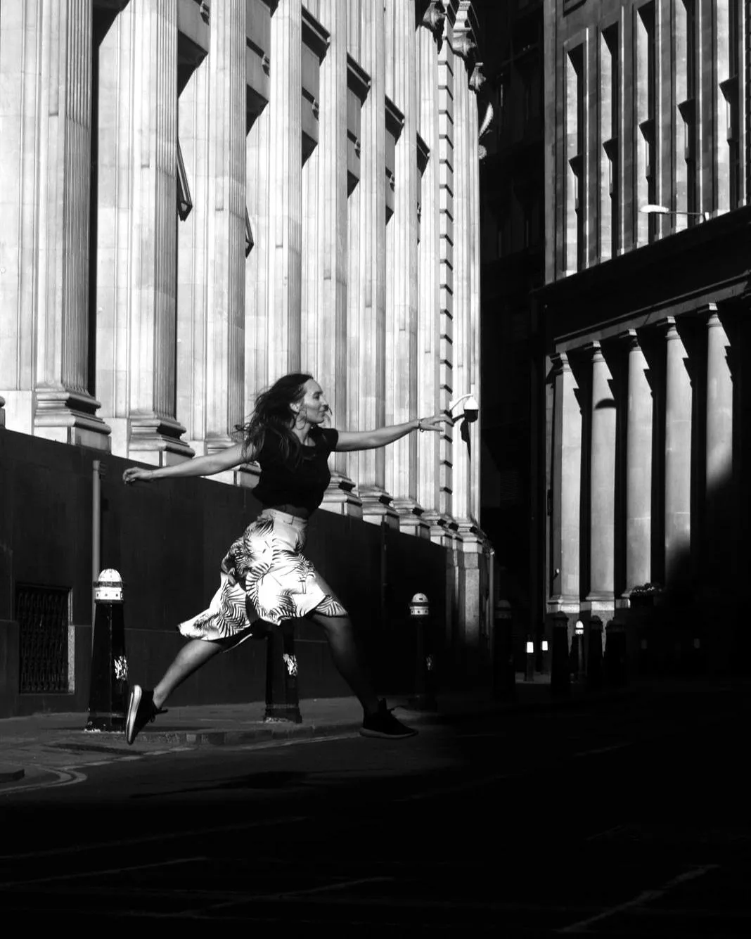 female dancer jumping through streets of London