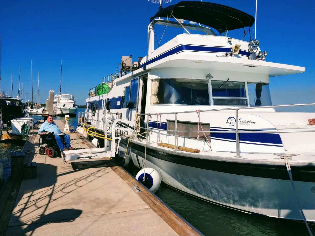 hands formed together with red heart paint