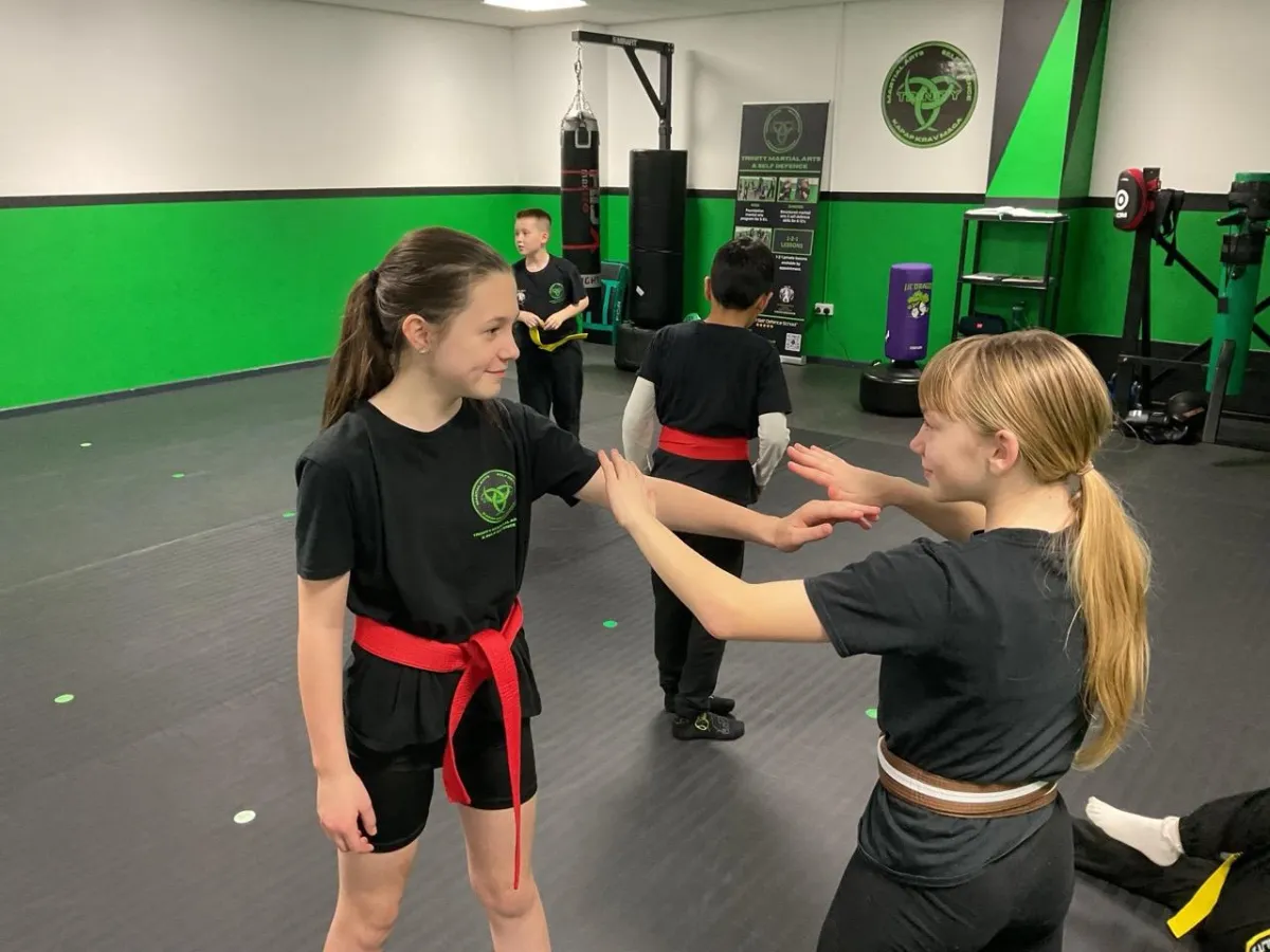 Children aged 8–13 training in junior martial arts and self‑defence