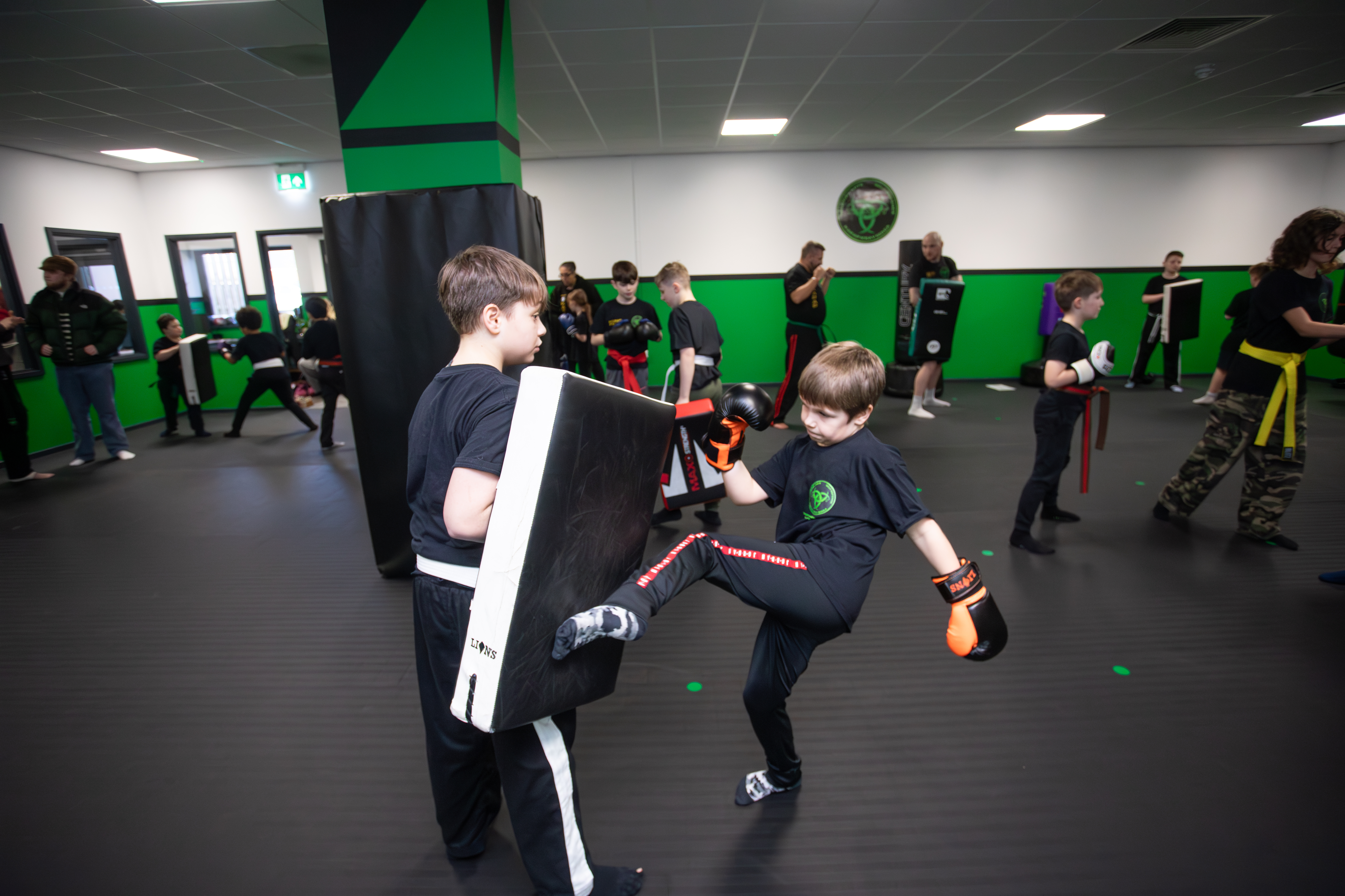 Children, teens and adults training together at Trinity Martial Arts & Self Defence in Dawley