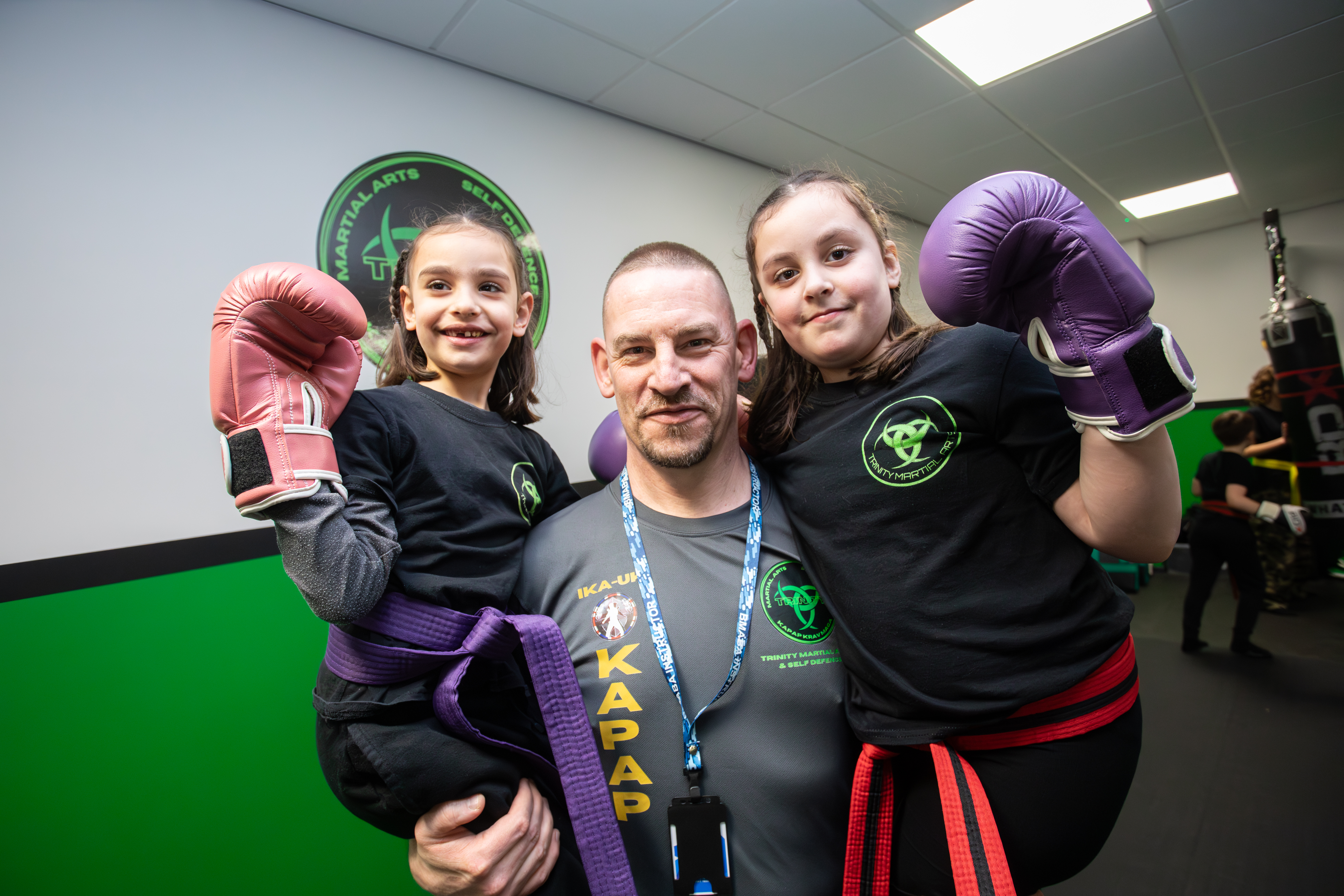Parent and child smiling after a martial arts session at Trinity Martial Arts & Self Defence