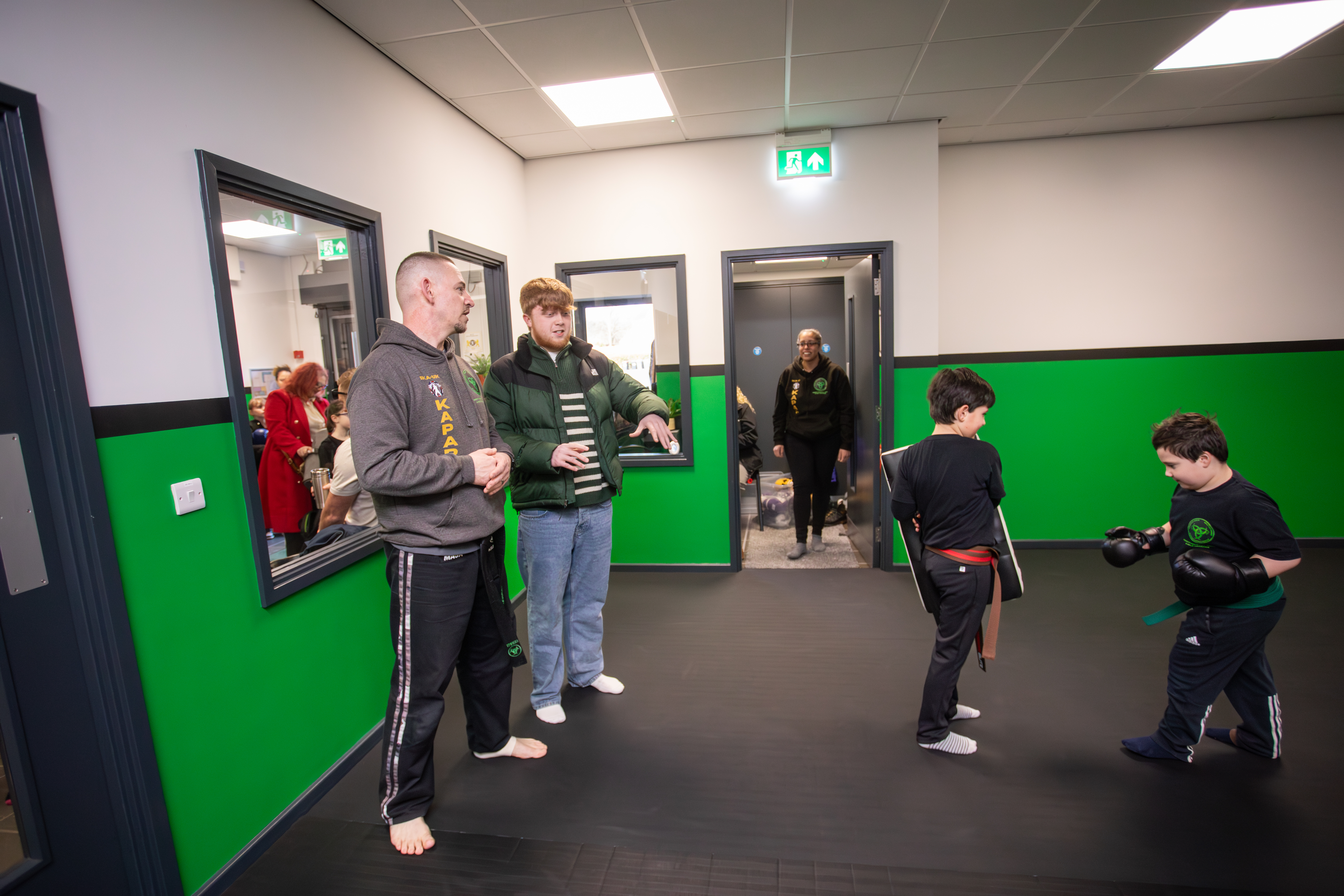 Instructor answering questions from adult students in class