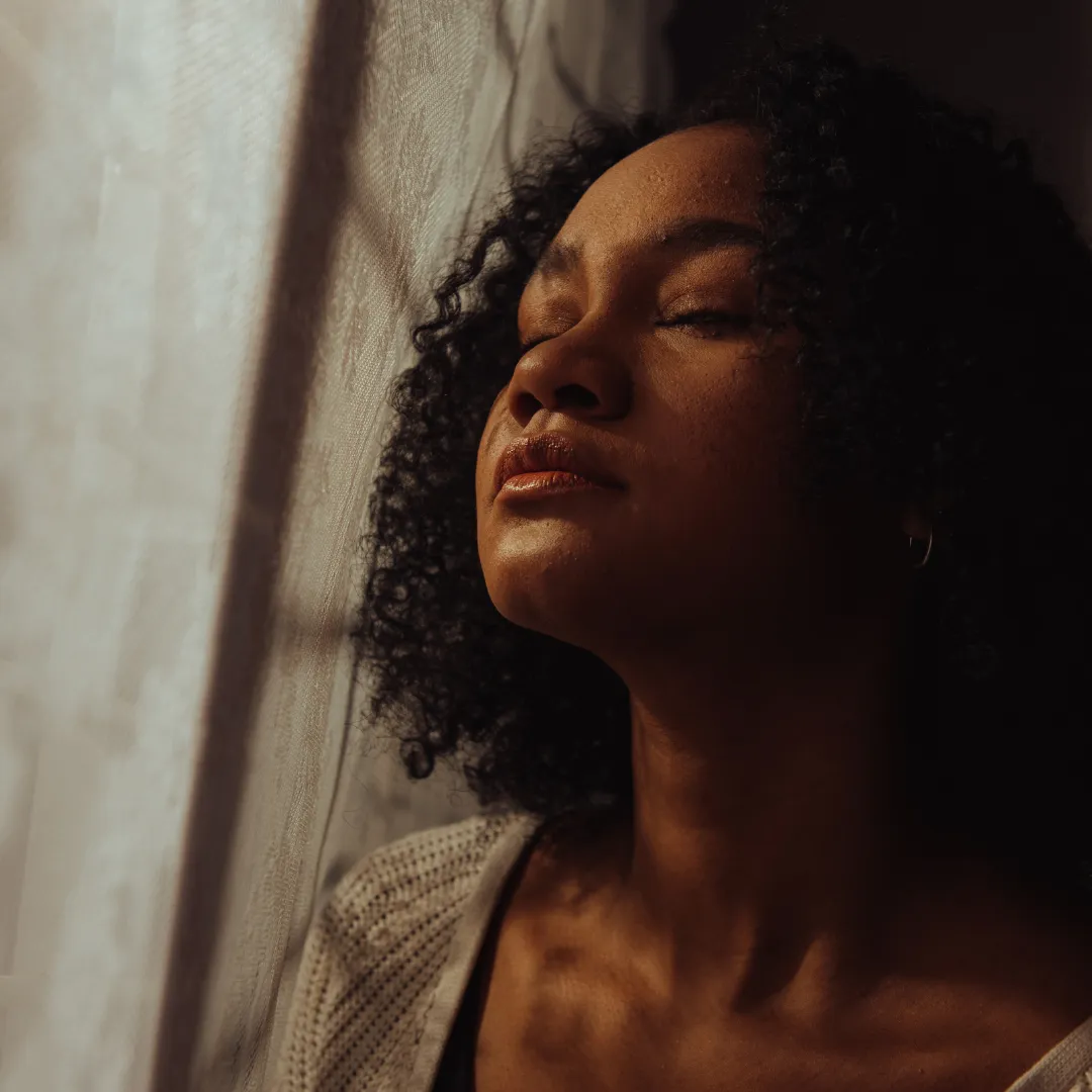 A modern professional experiencing mental fatigue and seeking restoration