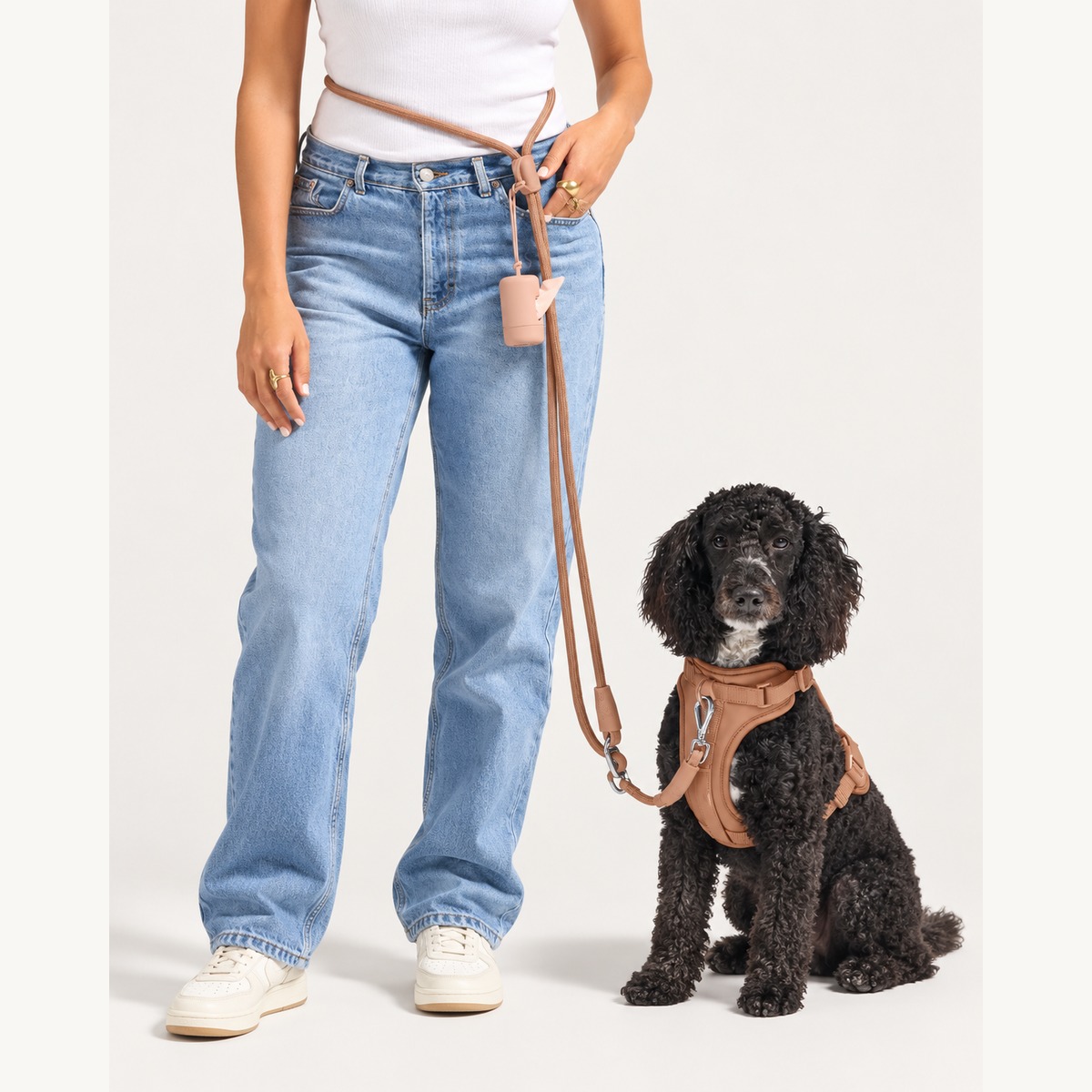 Hands-free rope dog leash worn around the waist with a dog