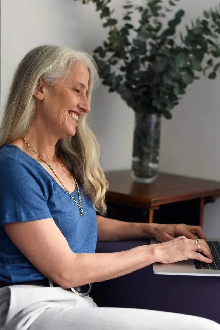 Megan, a clinical hypnotherapist, preparing an online RTT session.