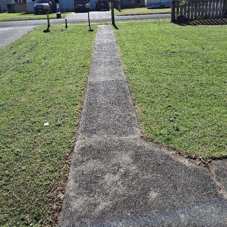  lawn mowing and edging service in Gisborne backyard