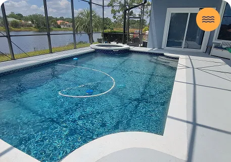 Person using a pool vacuum to clean water, emphasizing strong pool maintenance services by Strong Tower Pool.