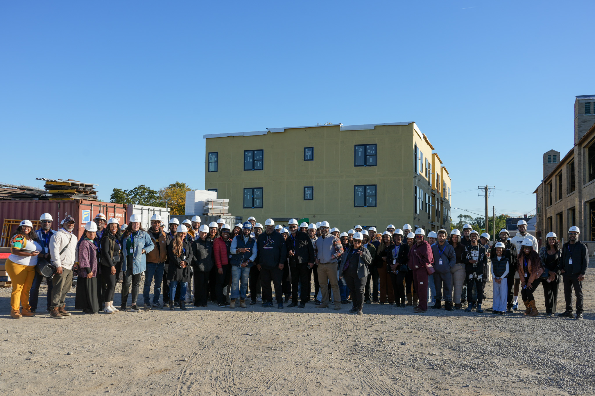 READ members standing in front of a Detroit development project