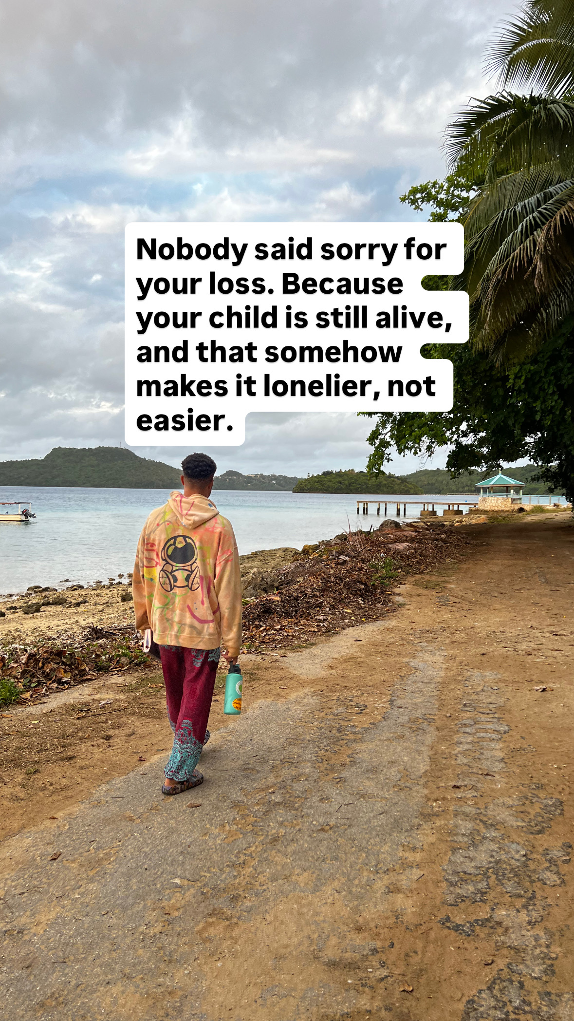 tah whitty, man walking down beach alone