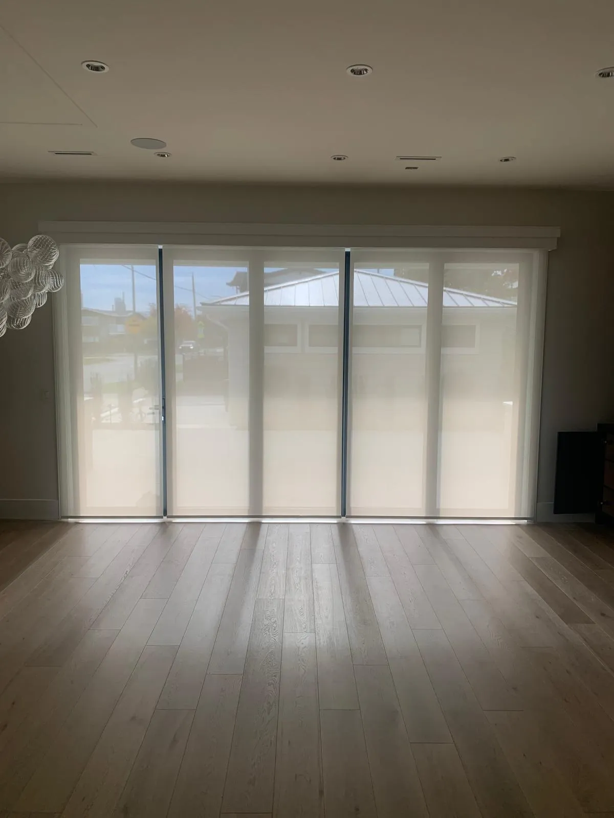 Modern entrance with striped curtains and plants