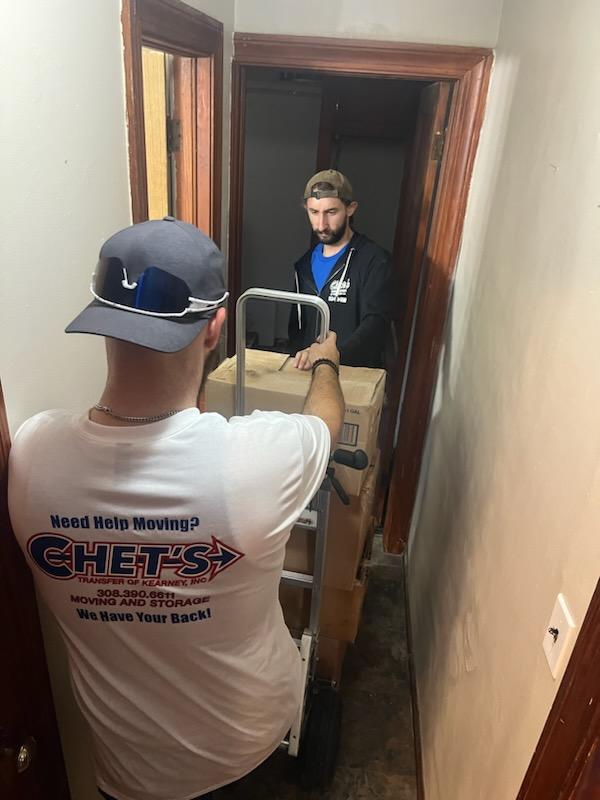 Chet's Transfer of Kearney, Inc. crew member loading items in the truck
