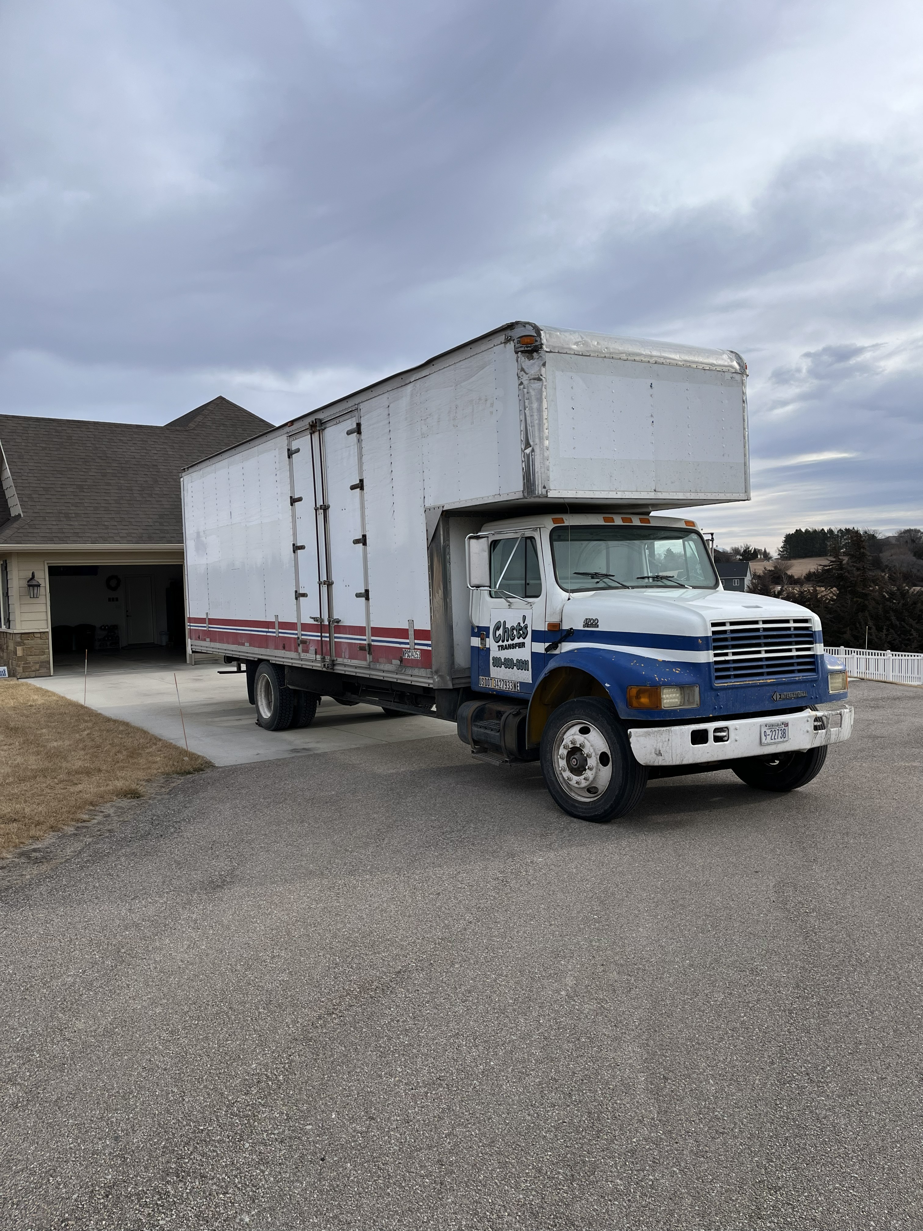 Chet's Transfer of Kearney, Inc.'s truck in front of a building