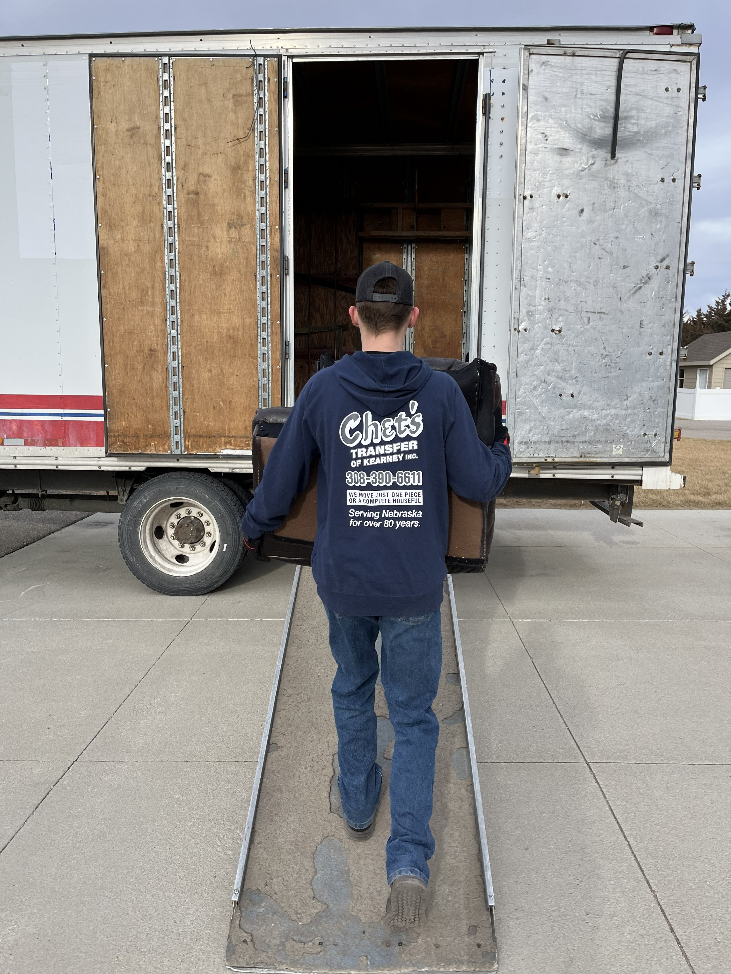 Chet's Transfer of Kearney, Inc. crew members safely loading iterms into the truck