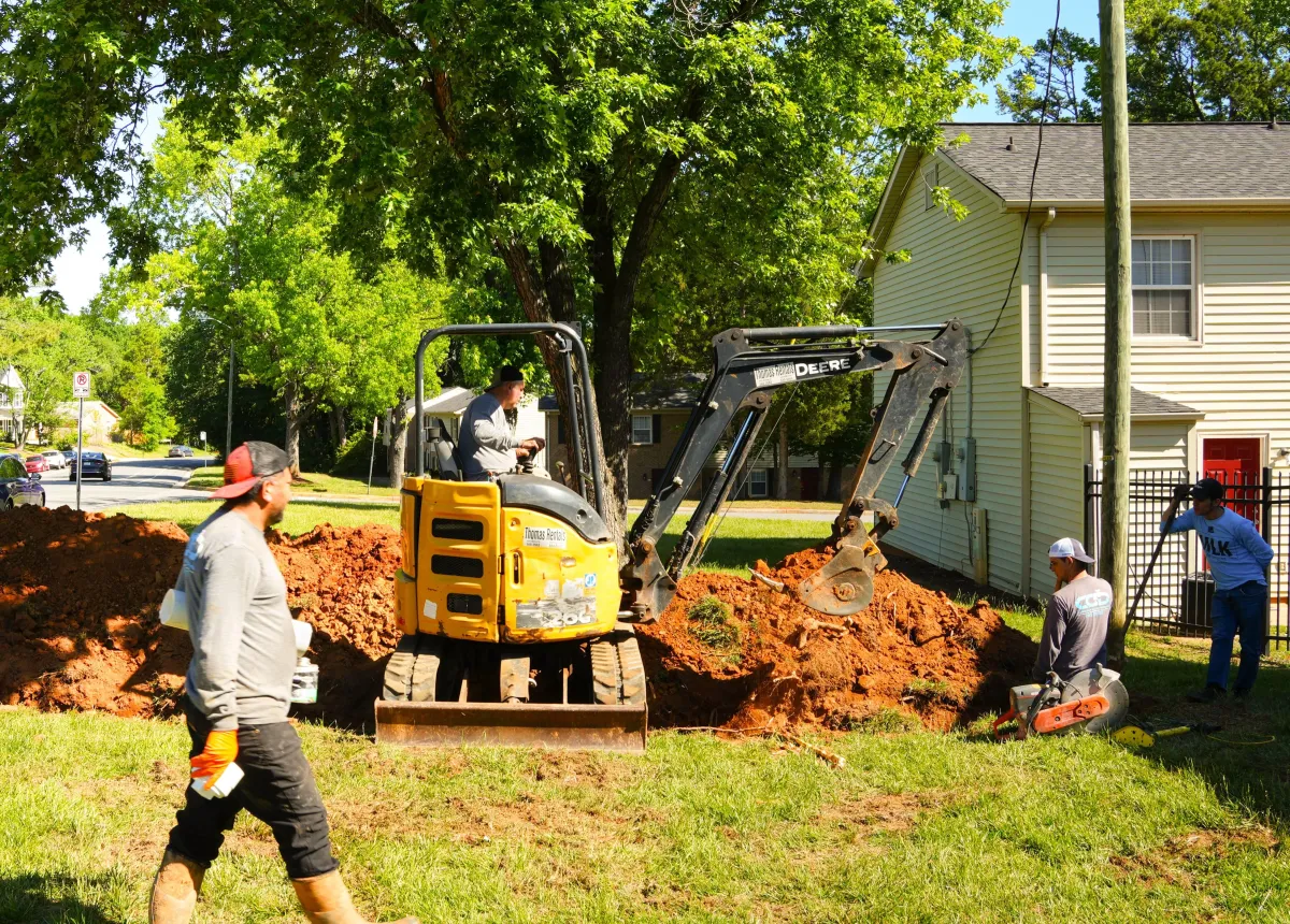 Carolina Clean Drains crew working together on plumbing and drain service project in the Charlotte NC area