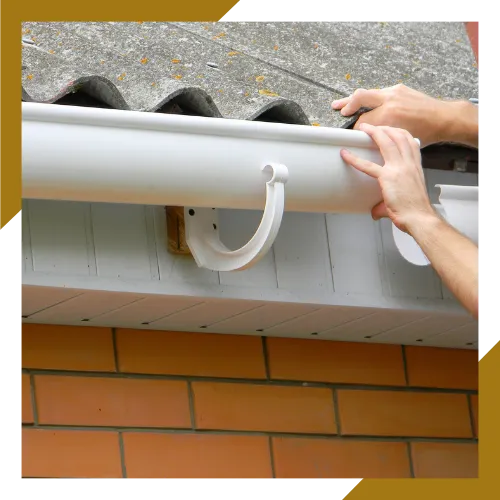 Professional gutter repair team securing sagging gutter sections
