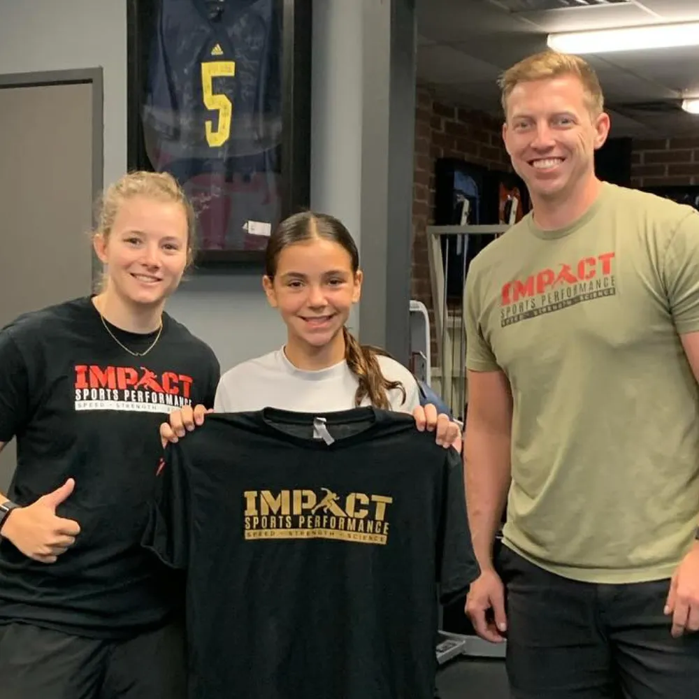 New youth athlete welcomed to Impact Sports Performance program with coach
