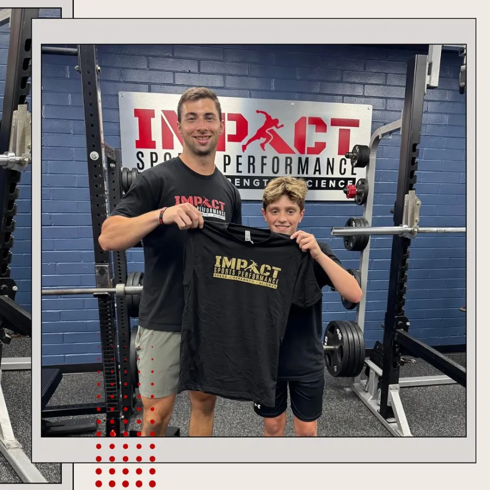 Youth sports performance athlete receiving Impact Sports Performance training shirt with coach