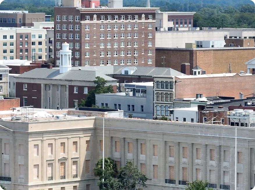 Professional window replacement services for Wilmington Delaware homes with city skyline background