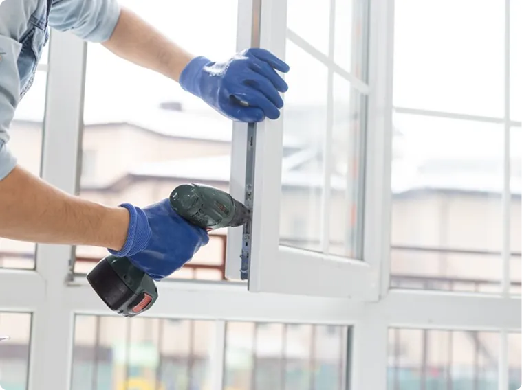 Professional installer ensuring proper sealing and installation of energy efficient windows in Delaware home