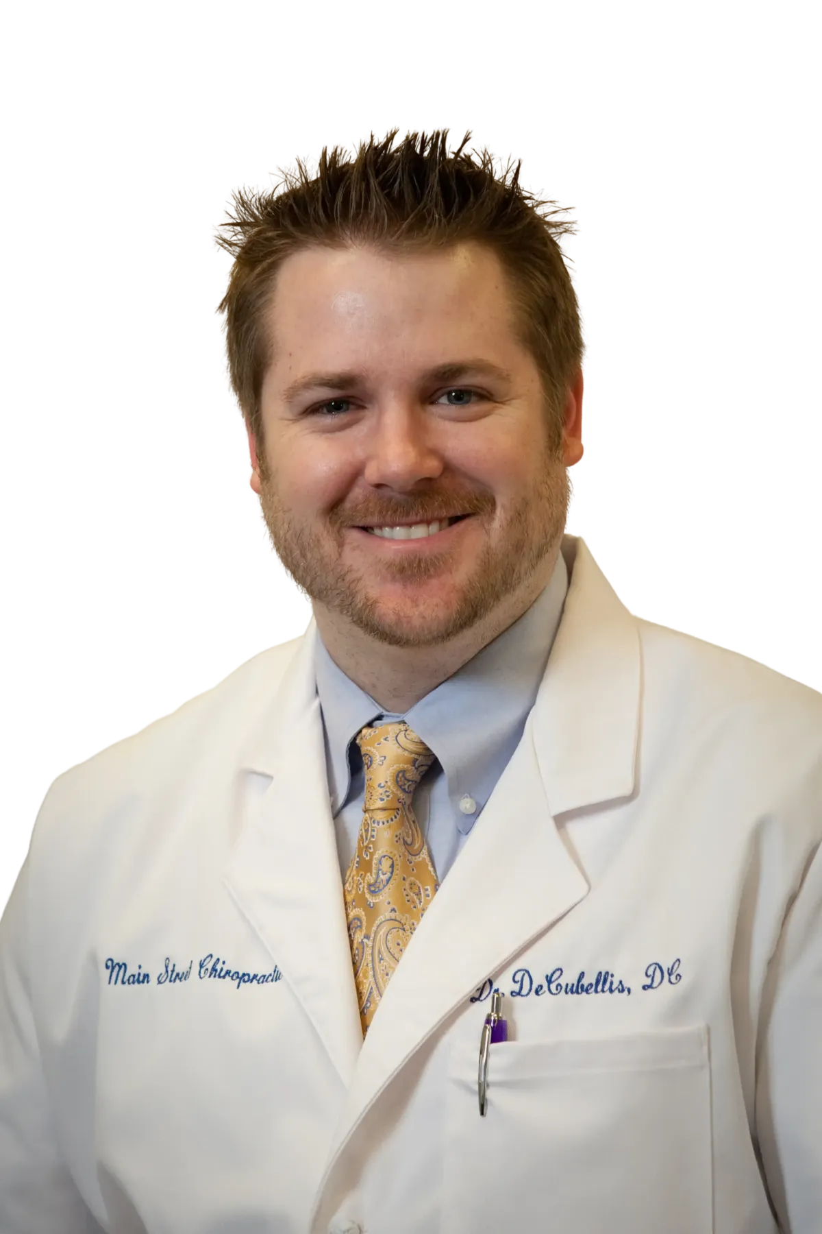 Dr. from AlignWell Chiropractic smiling in the clinic