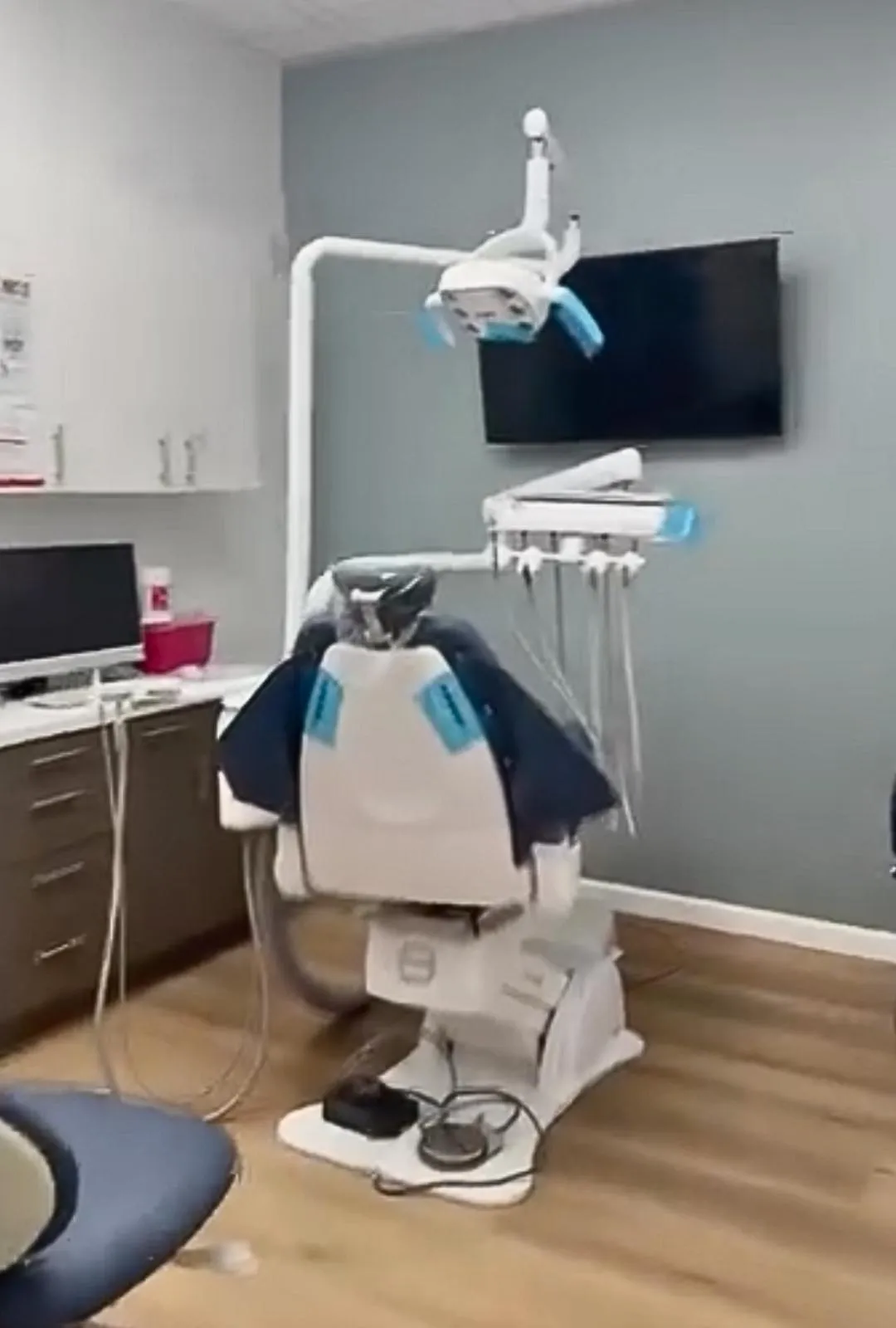 Dental treatment room with patient chair and equipment at Redlands Town Dental