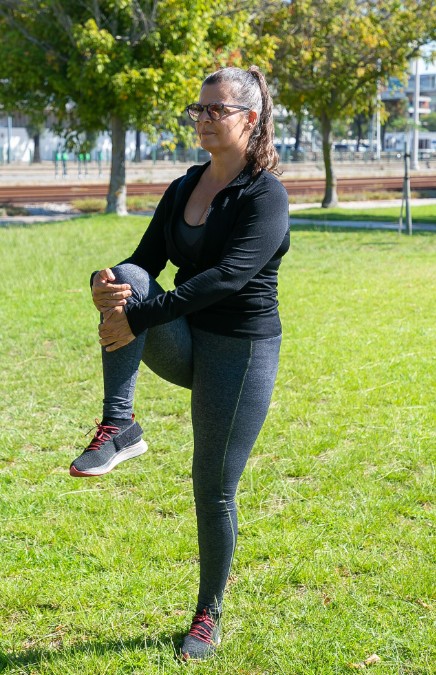 woman stretching outdoors enjoying gentle support for monthly discomfort with pms and pmdd treatment in woodbury mn.