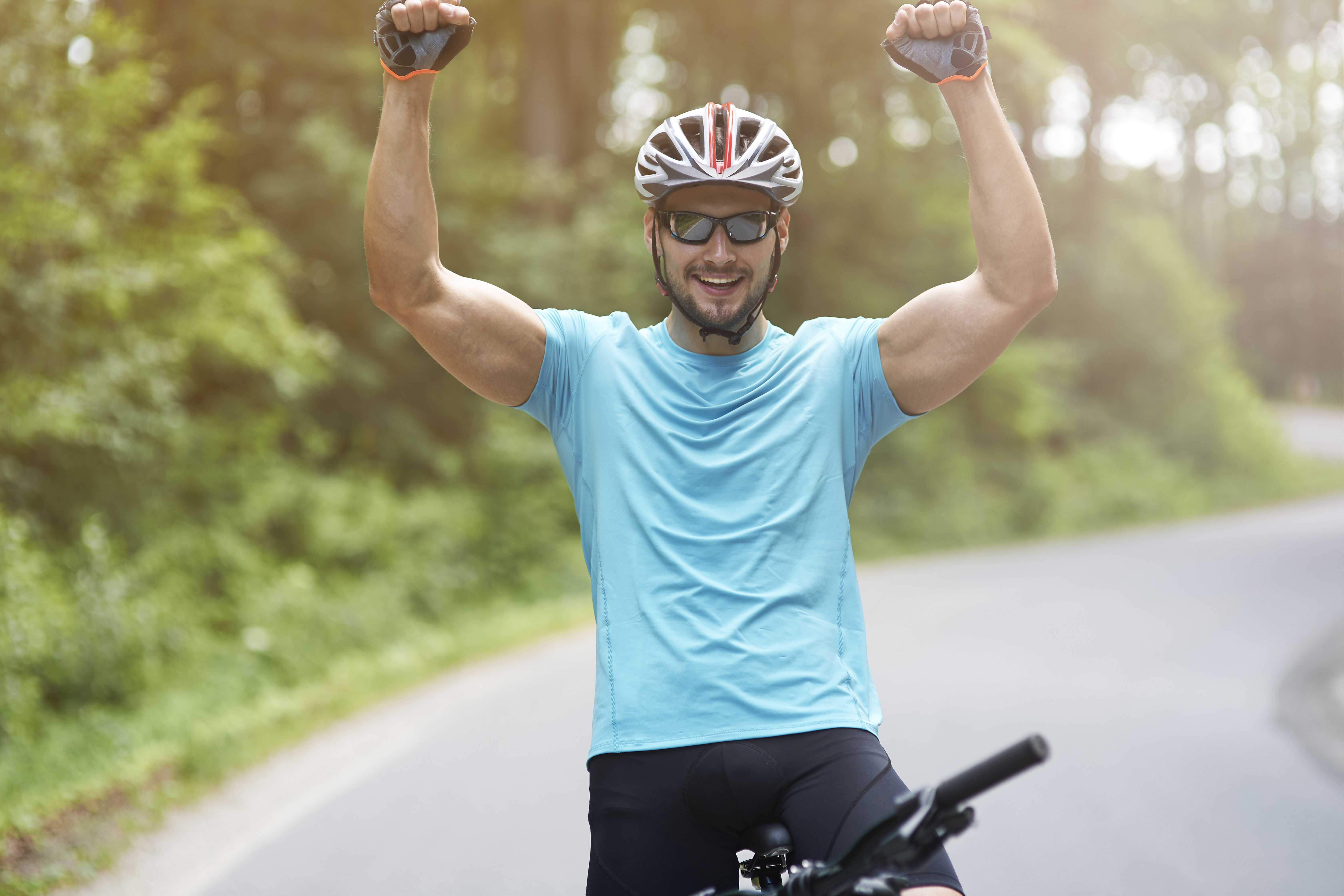 man successfully completing a bike ride feeling strong after healing at acupuncture clinic in woodbury mn.