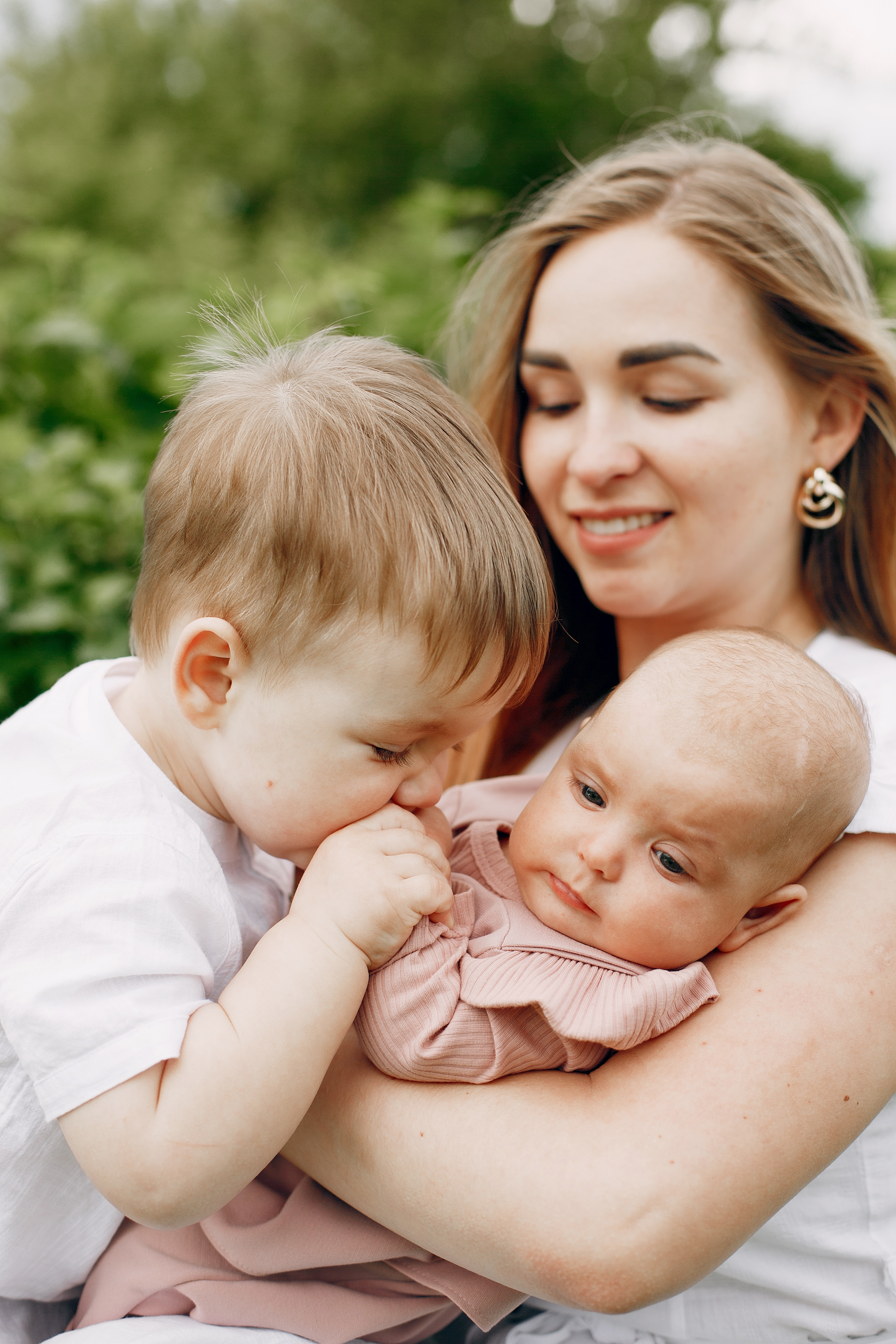 mother and daughter sharing a moment in a sunny field, a happy result of care from woodbury mn fertility clinic.