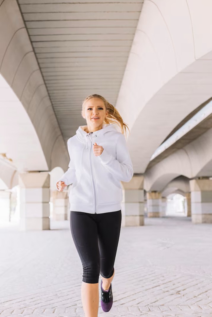 woman happily running outside after receiving care at the best acupuncture clinic in woodbury mn.