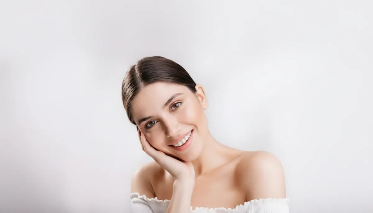 woman smiling with healthy, glowing skin after a facial acupuncture treatment at clinic in woodbury mn.