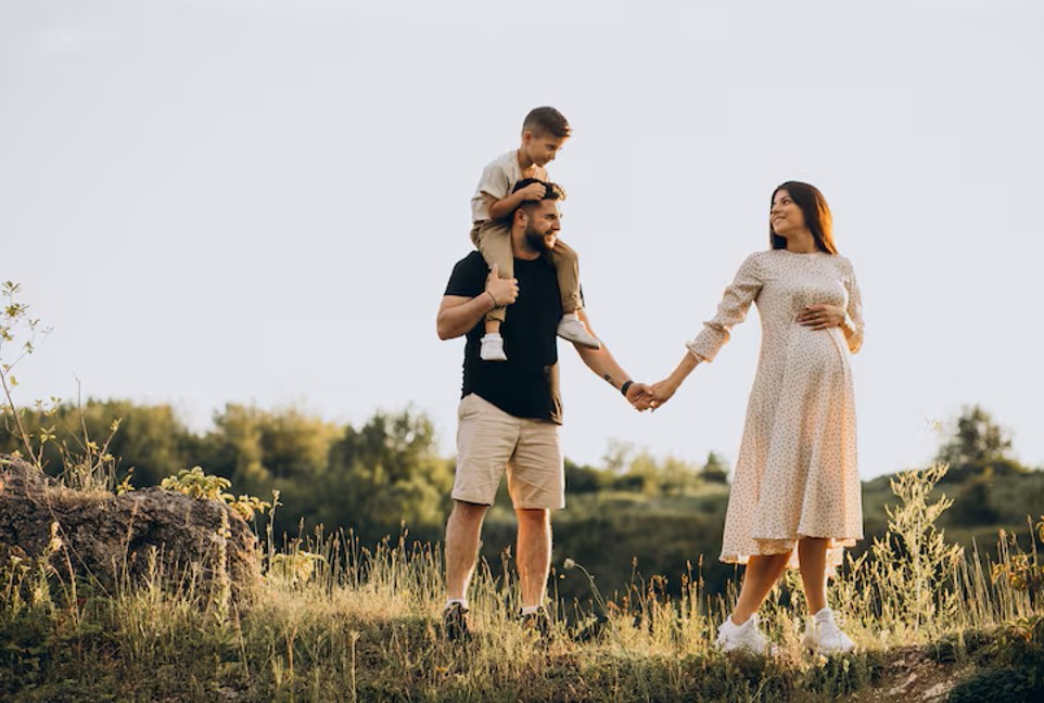 pregnant woman with husband and son enjoying time outdoors after fertility acupuncture clinic support in woodbury mn.