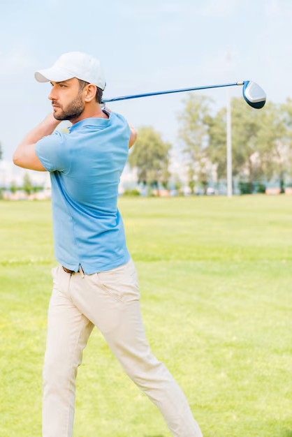 male golfer following through on swing after visiting a professional chinese medicine clinic in woodbury mn for back care.