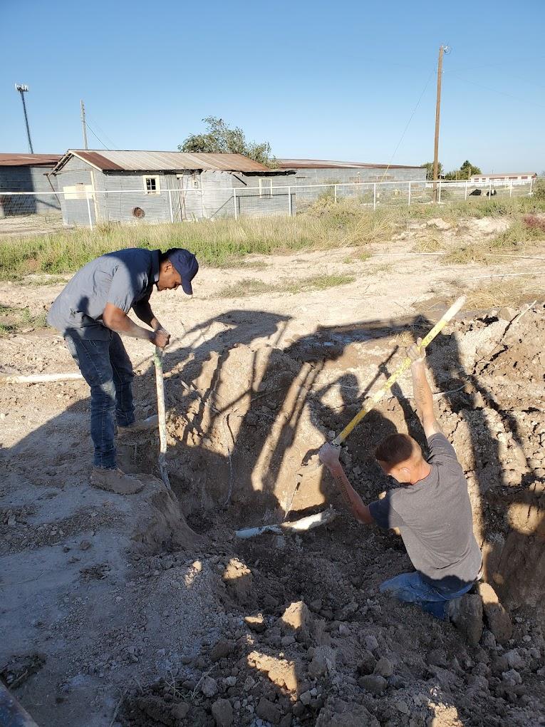 Our team digging up a sewer system.