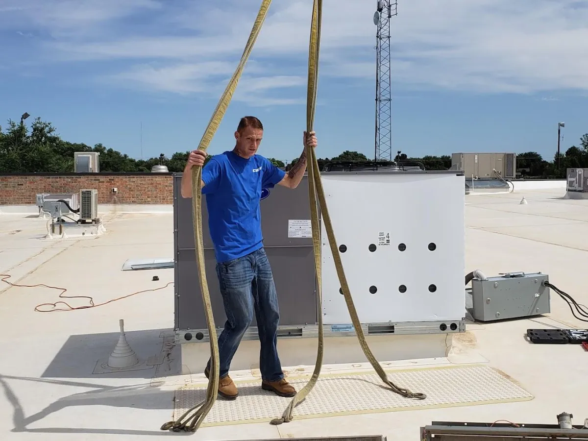 One of our technicians replacing an HVAC unit on a building