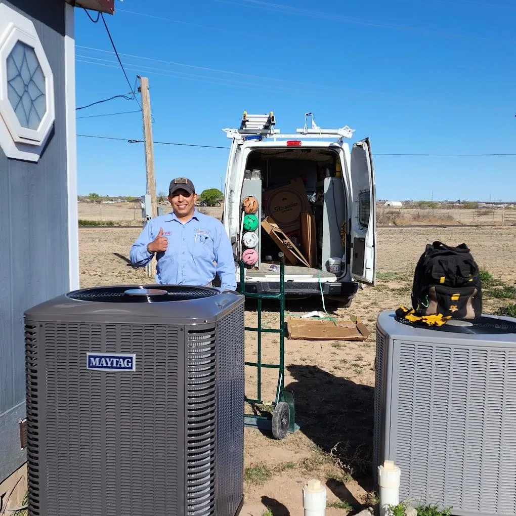 Dan smiling with his thumbs up in front of an new installed HVAC unit.