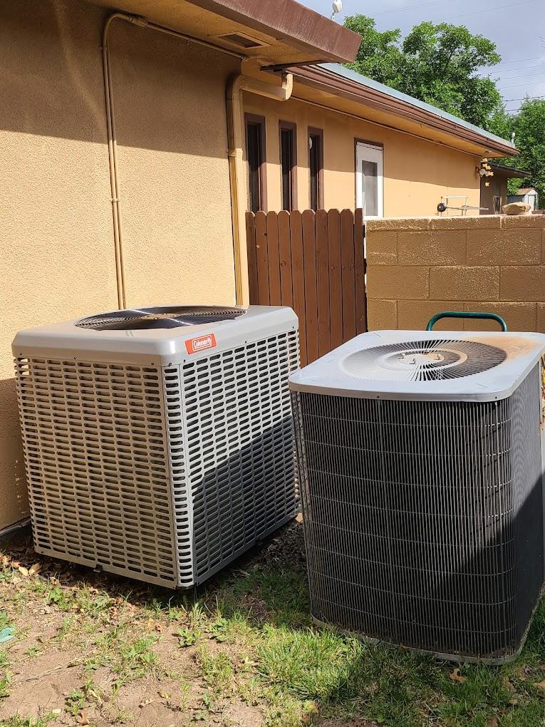 Coleman HVAC units outside of a home.