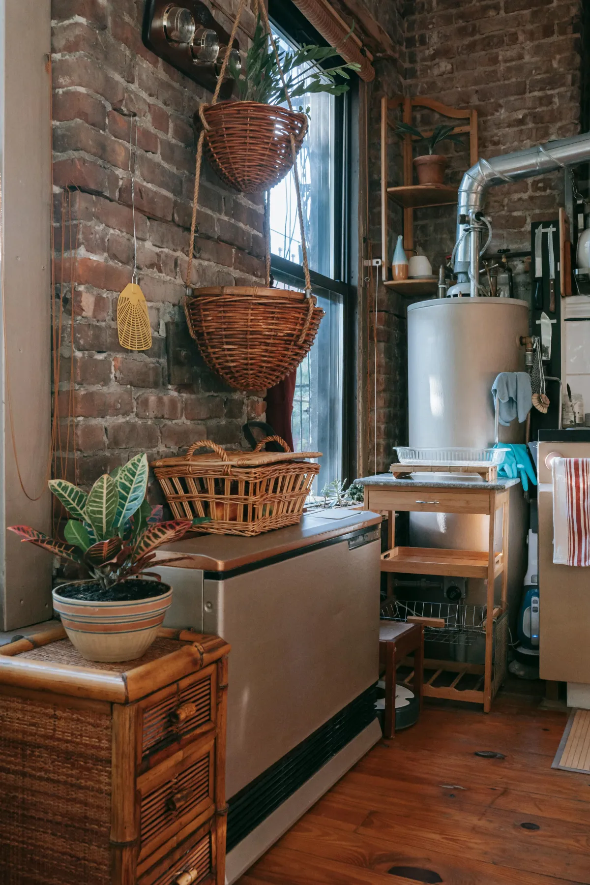 Giant water heater tucked in the corner of a room.