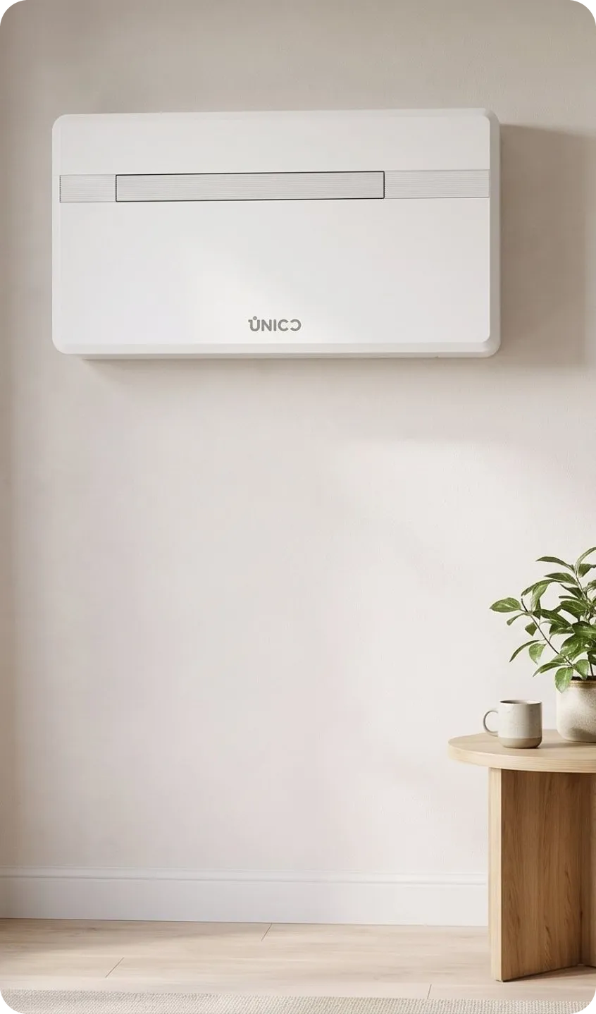 Sleek indoor single-unit climate control system mounted seamlessly inside an elegant modern UK living room with no outdoor condenser