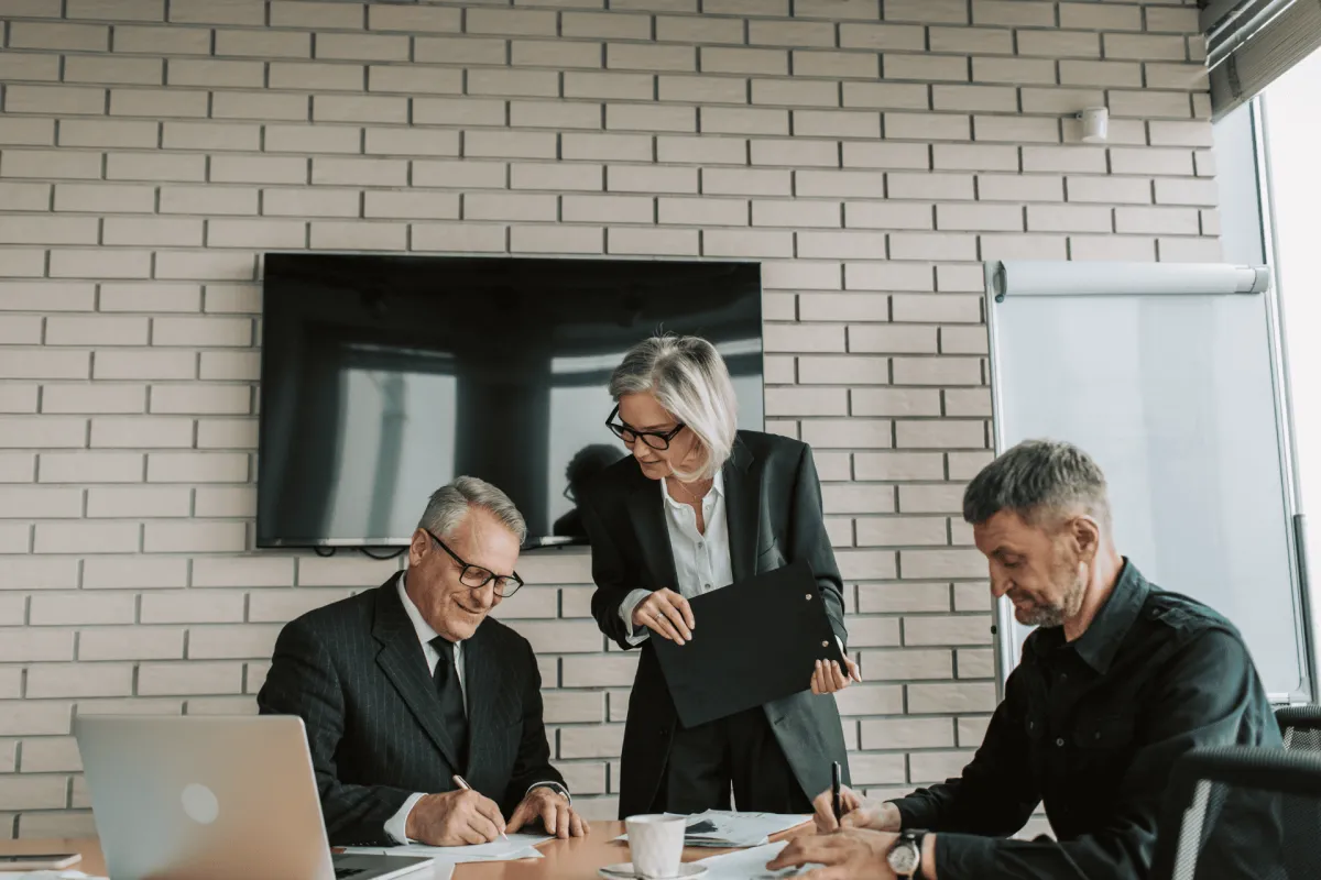 Business team discussing documents in a conference room