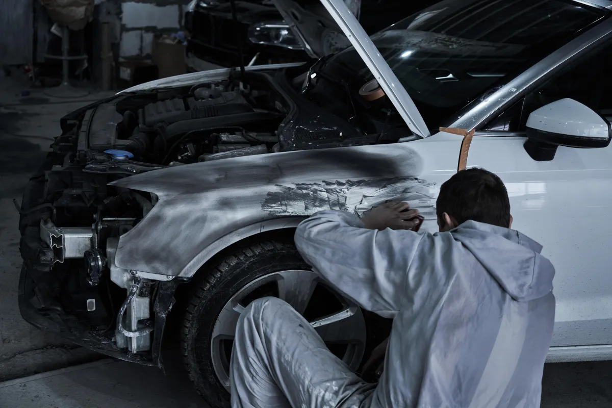 man holding camera with tripod during daytime