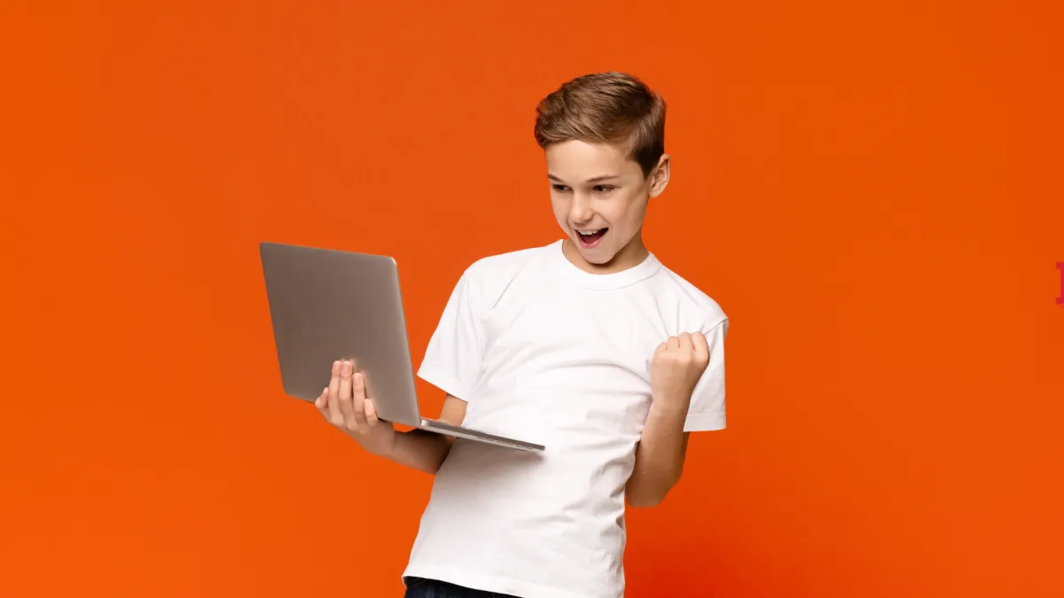 Kids moving with the teacher on a large screen TV