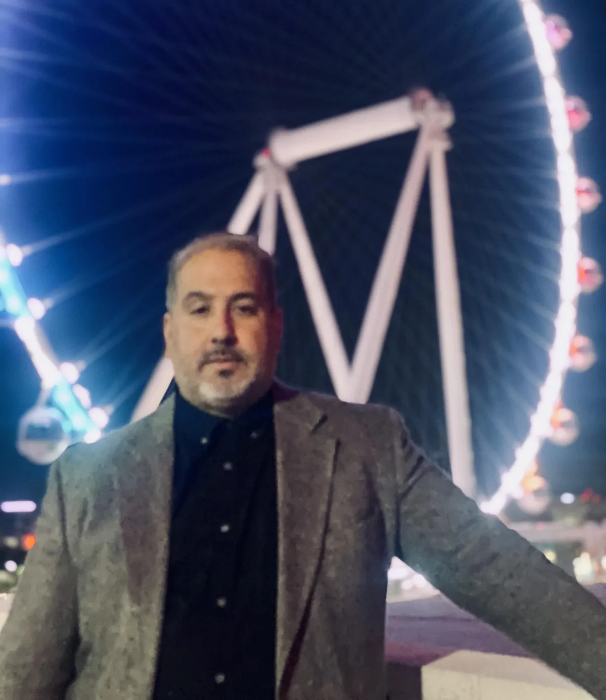 James Nathanel Salazar in rehearsal, reading sheet music in a sunlit studio, casual attire, focused expression, surrounded by musical notes and a grand piano.