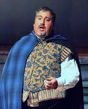 James Nathanel Salazar laughs with fellow performers during a post-show gathering. The group is diverse, dressed casually, and the atmosphere is relaxed and joyful, offering a glimpse into the camaraderie behind the scenes.