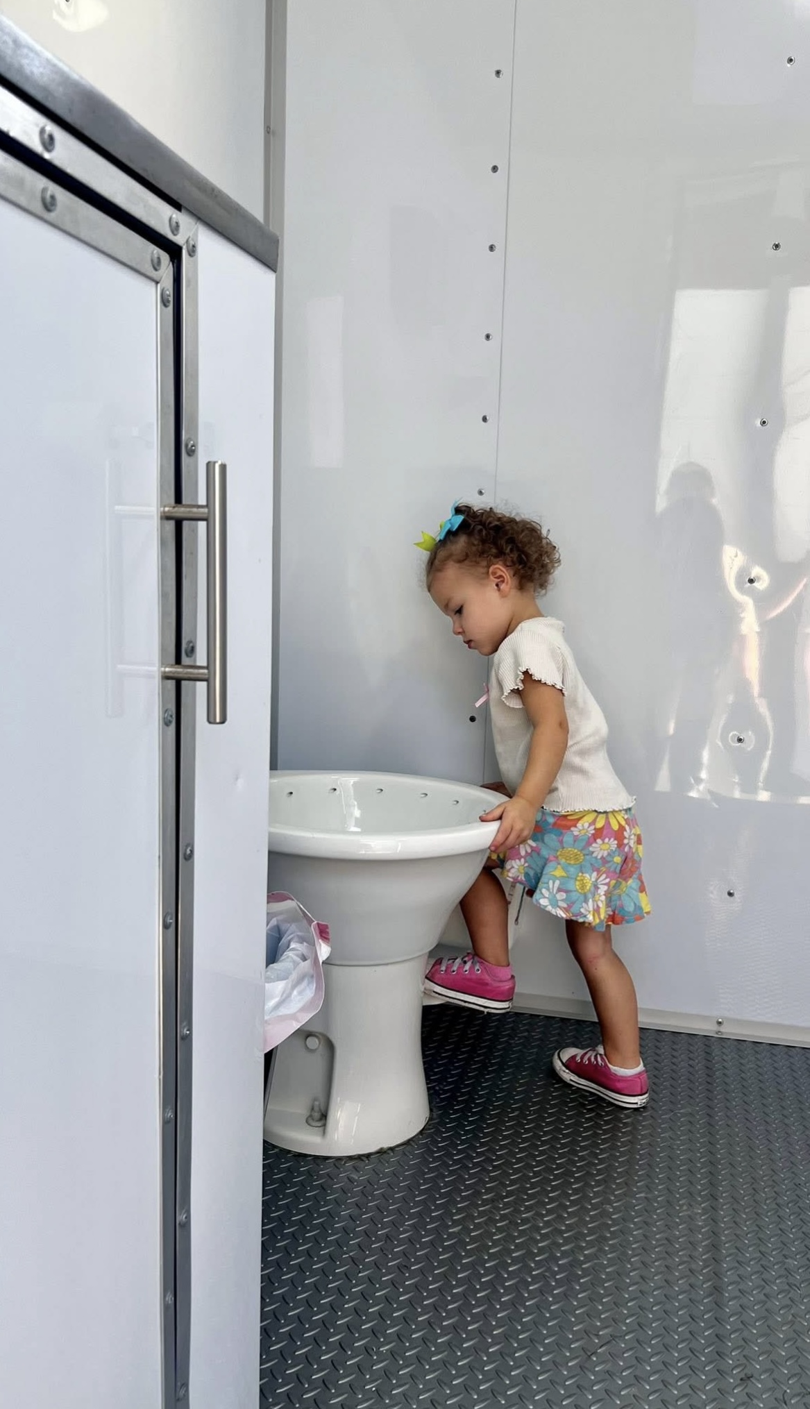 person washing hands in open faucet