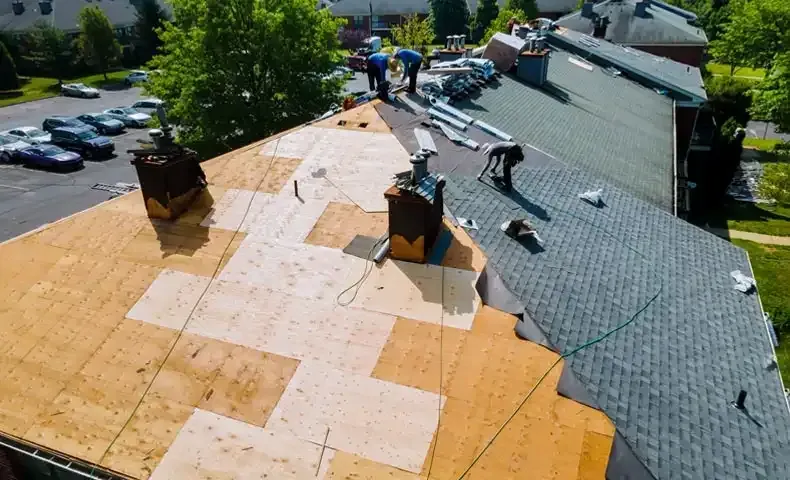 synthetic underlayment being applied to roof