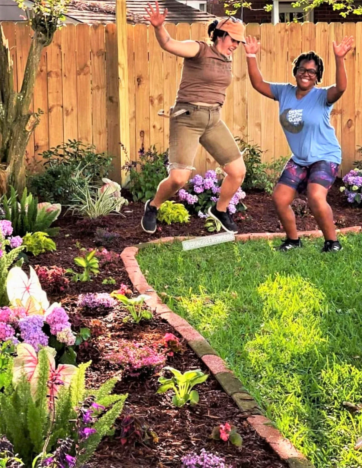 Gardener receiving hands-on coaching in a vegetable bed
