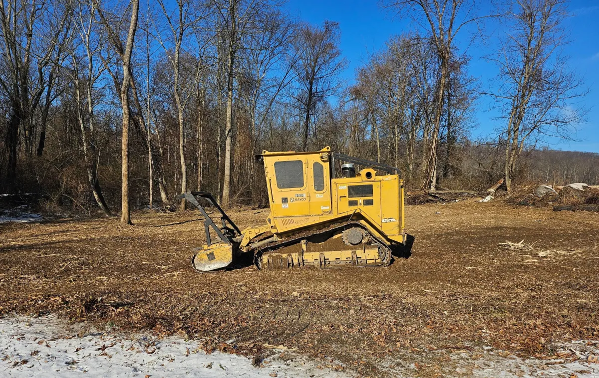 Forestry mulcher clearing brush